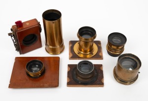 Group of five brass lenses (including Dallmeyer/Beck/Goerz models), together with Thornton-Pickard&nbsp;Time & Inst. roller-blind shutter and miscellaneous element. (7 items)