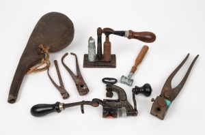 Antique bullet making presses, moulds and powder flask, 19th/20th century, the powder flask 25cm long