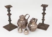 A pair of sterling silver candlesticks (weighted bases), together with a pair of sterling silver bomb condiments, a sterling silver cream can and milk jug, (6 items), the candlesticks 12cm high