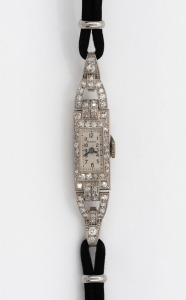 A vintage 18ct white gold and diamond ladies cocktail evening watch