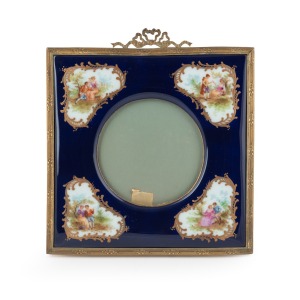 An antique French porcelain picture frame with gilt metal mounts and easel stand, 19th century, 21 x 1.5cm.