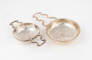 Two antique sterling silver tea and punch strainers, 18th/19th century, the larger 18cm long, 172 grams total.