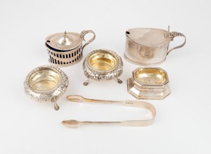 Antique sterling silver sugar tongs, pair of sterling silver salt cellars, two sterling silver condiment pots and a table salt cellar, 19th/20th century, (6 items), the tongs 15cm long, 434 grams silver weight (not including glass liners).