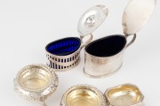 Antique sterling silver sugar tongs, pair of sterling silver salt cellars, two sterling silver condiment pots and a table salt cellar, 19th/20th century, (6 items), the tongs 15cm long, 434 grams silver weight (not including glass liners). - 2