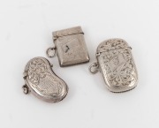 Three antique English sterling silver vestas with engraved decoration, including an unusual kidney shaped example, the largest 5.5cm high, 61 grams total