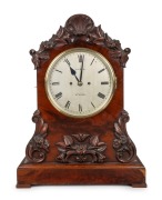 An antique English spring table clock in carved mahogany case, twin train fusee movement with Roman numerals, dial marked "FIELD. STROUD", mid 19th century, 54.5cm high