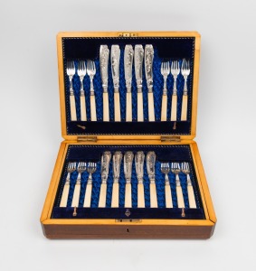 An antique silver plated fish cutlery service with engraved floral decoration and ivory handles, housed in original canteen, (setting for twelve with servers), 19th century, the canteen 26cm wide