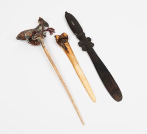 An antique lime spatula and two antique tribal bone daggers including one with unusual bird totem top, Papua New Guinea origin, (3 items), the largest 34cm high
