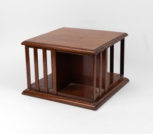 An antique mahogany desk top revolving book stand, circa 1900, ​​​​​​​28cm high, 38cm wide, 38cm deep