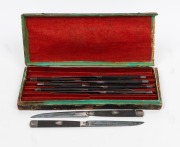 A set of eight antique French silver fruit knives with solid ebony handles, circa 1820, ​​​​​​​18.5cm long.