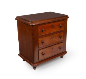 An Australian cedar three drawer miniature chest, 46cm high, 44m wide, 28cm deep