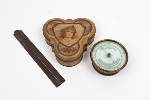 An antique wall barometer, together with an unusual folding rule, and a vintage tin, (3 items), the barometer 13cm diameter.