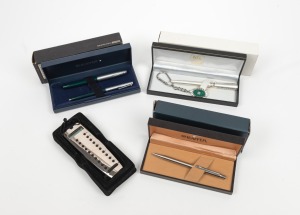 Currency converter in French silver case, together with three boxed pens including SHEAFFER and MILANO, (4 items)