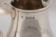 A vintage five piece English sterling silver tea and coffee service in the Georgian style with ebonised timber handles, manufactured in London, 20th century, the largest 22cm high, 2458 grams total (including handles) - 6