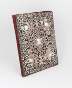 An antique sterling silver covered scarlet leather notebook, interior attractively finished in water wash scarlet silk with two ivory note pages, 19th century, 28 x 21cm overall