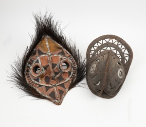 Two tribal masks woven rattan and fibre, feather and earth pigments, Papua New Guinea origin, circa 1965, 42cm and 32cm high.
