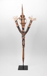 Malekulah puppet funerary effigy carved wood with natural earth pigments and boar tusks, Vanuatu origin,&nbsp; on museum stand and bearing a Sotheby's auction label, 91cm high not including stand