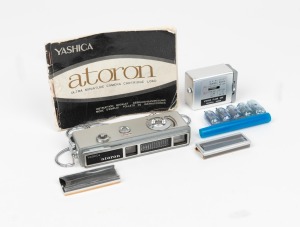 YASHICA: Atoron&nbsp;subminiature camera, c. 1970,&nbsp;with flash unit, two lens filters, four flash bulbs, and instruction booklet.