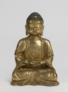 A Sino-Tibetan gilt bronze seated Buddha statue, 20th century, ​​​​​​​19cm high.