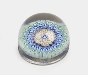 An antique French glass paperweight with millefiori decoration, 19th century, 6cm high, 9.5cm diameter