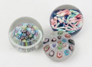 Three Murano glass paperweights, ​​​​​​​the largest 7cm high.
