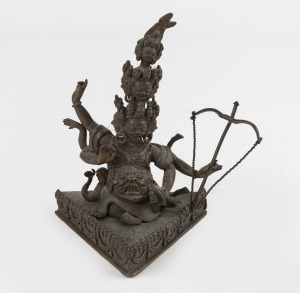 An antique Sino-Tibetan bronze deity figure holding bow and arrow, 19th/20th century, 13cm high