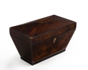 An antique mahogany tea caddy, 19th century, interior fitted with two lidded compartments with whalebone handles, 16cm high, 25.5cm wide, 14cm deep.
