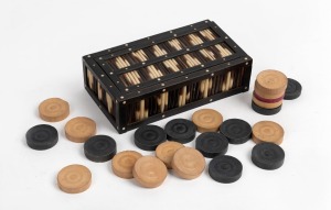 An antique Anglo-Ceylonese ebony and porcupine quill box with ivory and bone inlay, housing some antique gaming pieces, 19th century, the box 17cm wide.