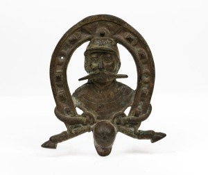 An antique cast brass jockey&nbsp;wall plaque, 19th/20th century, 20cm high.