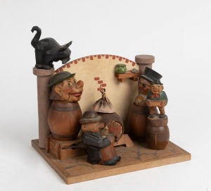A vintage Italian carved timber bar bottle stopper set with hand-painted finish and clockwork musical mechanism, early 20th century, ​​​​​​​22cm high.