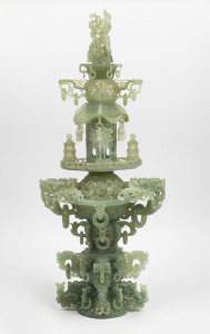 A vintage Chinese ornate carved jade pagoda ornament, (some losses), 20th century, ​​​​​​​76cm high.