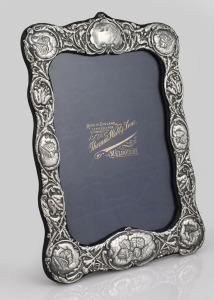 An antique sterling silver picture frame, retailed by Thomas Webb & Sons of Melbourne, 27 x 21cm overall