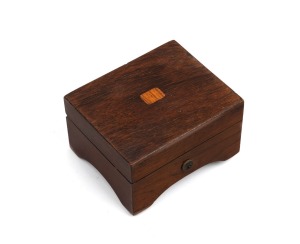 An antique Swiss miniature clockwork music box in rosewood case with original paper label inside the lid, 19th century, 5.5cm high, 9.5cm wide, 8cm deep