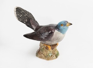 BESWICK English porcelain bird statue, impressed factory mark and original green label to base, 12cm high, 19.5cm long