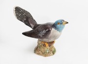 BESWICK English porcelain bird statue, impressed factory mark and original green label to base, 12cm high, 19.5cm long