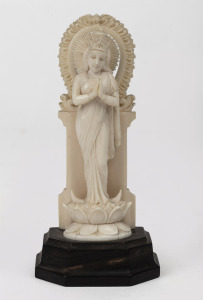 An Indian carved ivory statuette on timber stand, early to mid 20th century, ​​​​​​​12cm high overall.