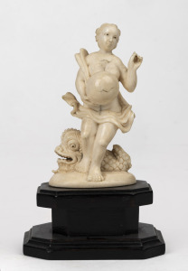 An antique Dieppe ivory fertility statue of a woman and dolphin, mounted on ebonised timber base, 19th century, 12cm high overall
