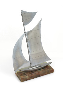 A vintage nickel plated yacht ornament on green onyx base, early to mid 20th century, 26cm high