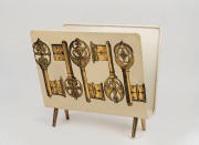 FORNASETTI vintage Italian magazine rack, circular foil label to base "FORNASETTI, MADE IN ITALY", 38cm high, 43cm wide, 22cm deep.