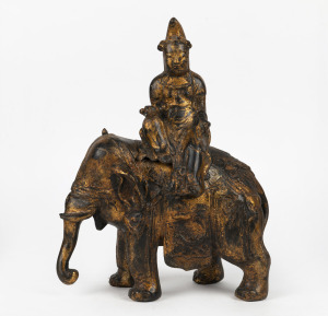 A Chinese cast spelter elephant and rider with remains of gilt finish, 20th century, 40cm high.
