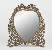 An antique English heart shaped table mirror with pierced brass acorn frame and easel stand, 19th century, 43 x 37cm