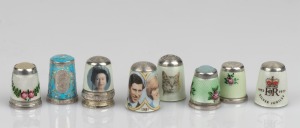 THIMBLES: A selection of silver and enamel examples including Royal themes, 20th century, (8 items), the largest 2.5cm high