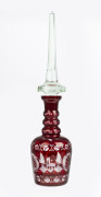 A Bohemian ruby overlay decanter with wheel cut engraving, 20th century, an imposing 60cm high.