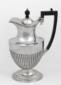 An antique sterling silver hot water jug with ebonised handle and finial, by Mappin & Webb of Sheffield, circa 1907, 26cm high, 584 grams total including handle and finial.