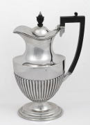An antique sterling silver hot water jug with ebonised handle and finial, by Mappin & Webb of Sheffield, circa 1907, ​​​​​​​26cm high, 584 grams total including handle and finial.
