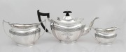 An antique English three piece sterling silver tea service by Herbert & Frank Barker, circa 1908, bearing inscription "Presented To W.J. ROSE By The Officers Of His Regiment, October, 1908". ​​​​​​​the teapot 14cm high, 1120 grams total.