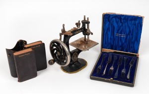 SINGER miniature sewing machine, boxed sterling silver cake forks, and a pair of pocket hymns&nbsp;books in slip case, (3 items)