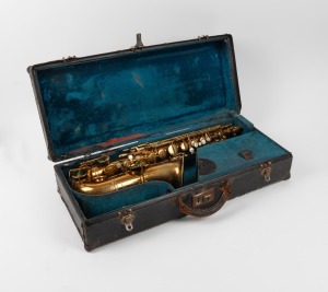 A vintage brass alto saxophone in fitted case