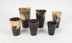 Six assorted antique horn beakers of varying sizes, including three with silver ownership plaques, 19th century, the largest 15cm high