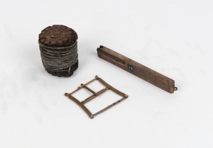 Underwater telegraph wire sample; together with a miniature bow saw and an antique percussion cap dispenser, 19th century, the largest 14cm long